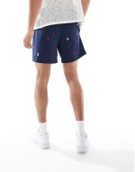 Traveler icon logo slim fit mid swim shorts in beige